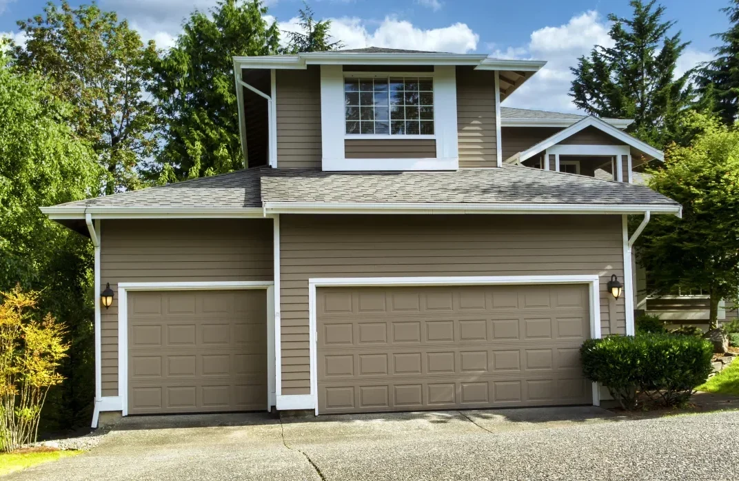 Well-maintained exterior paint on a two-story house with clean finish